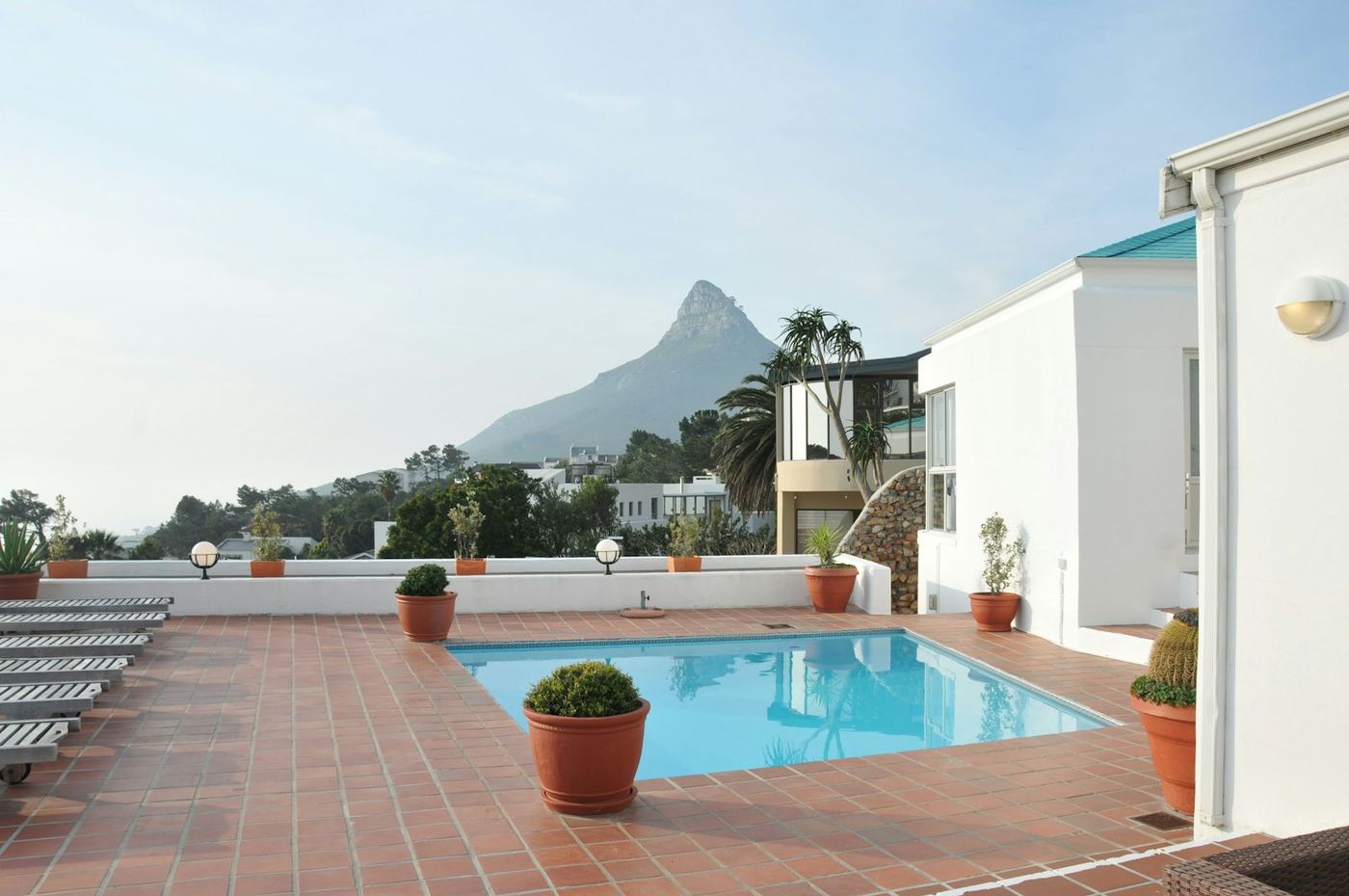 A villa pool with Lion’s Head behind