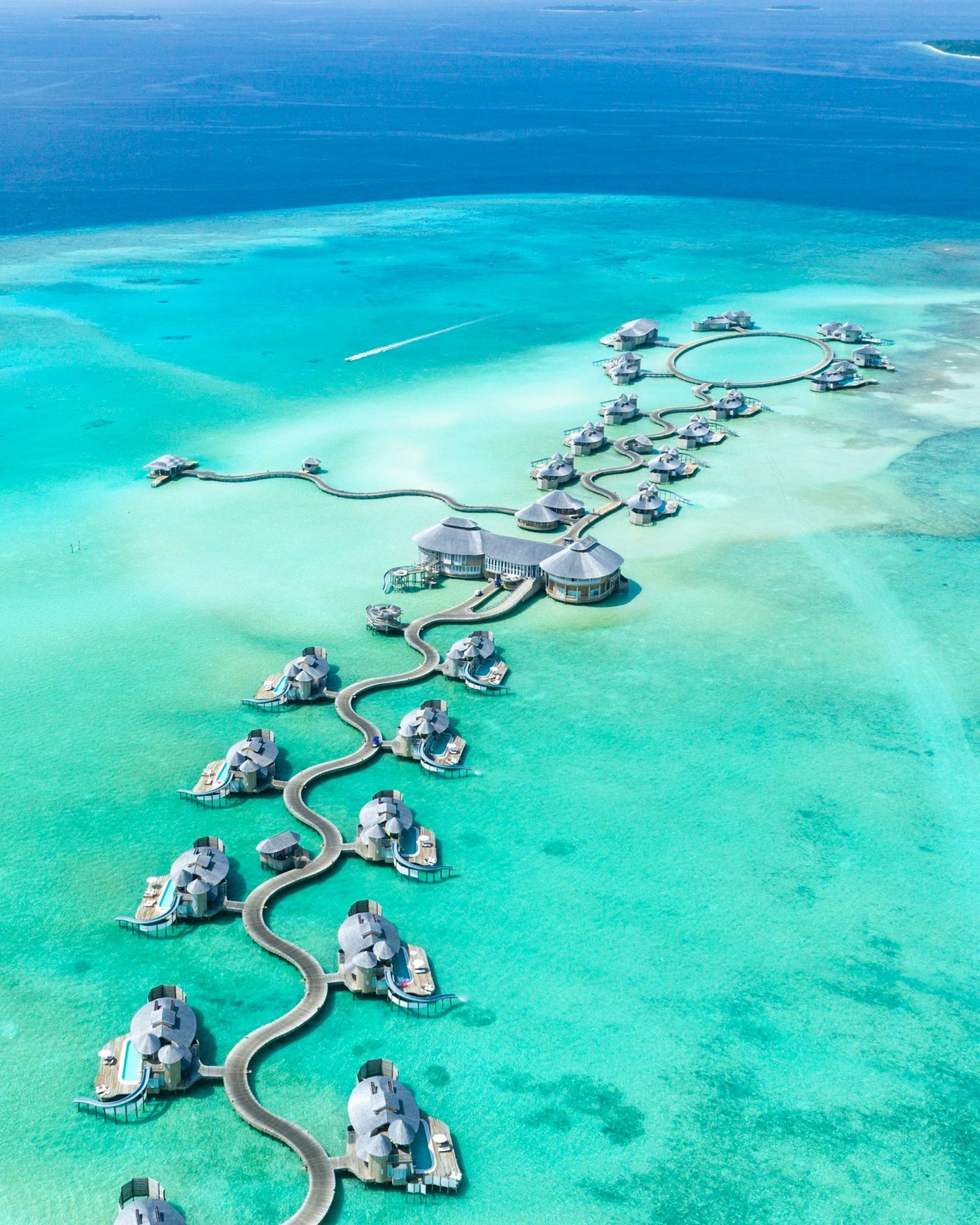 Overwater villas in a turquoise lagoon